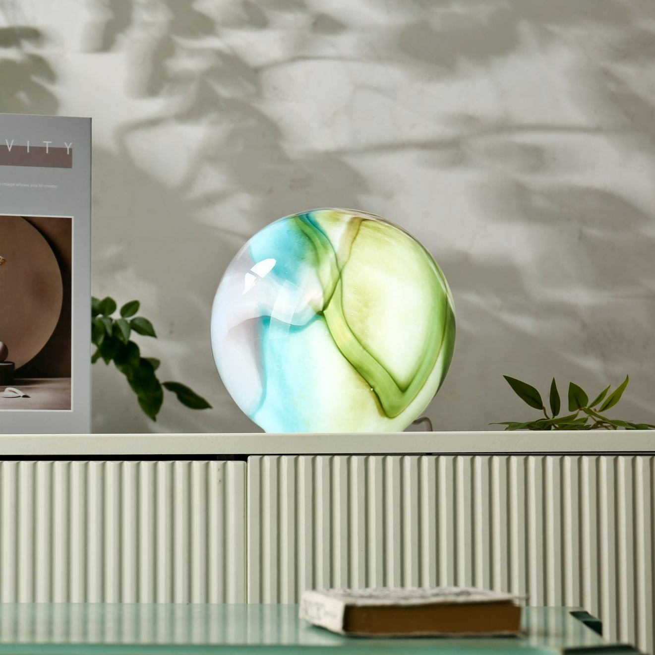 Handblown glass sphere lamp unlit showing the swirled glass